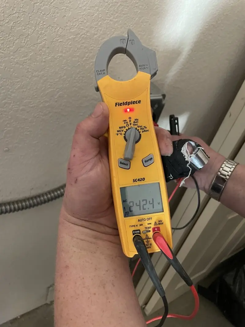 Voltage testing with clamp meter during Ceiling Fan Installation in Thurmont
